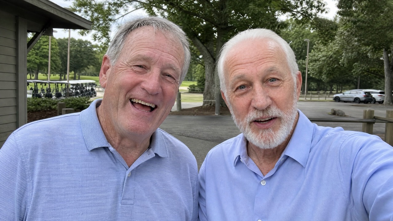 Selfie-style photograph of Dr. Rennard and Walt laughing together.